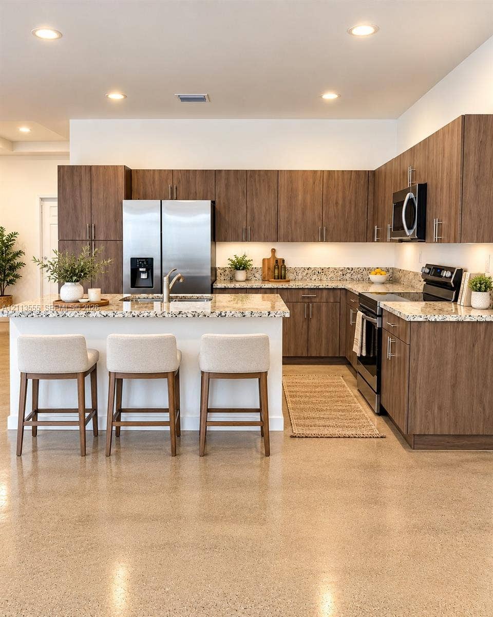 104 NW 31st Avenue, Fort Lauderdale, Fort Lauderdale, FL 33311 Kitchen featuring wood-finish cabinetry, stone-surface countertops, polished concrete flooring, stainless steel appliances, and recessed lighting
