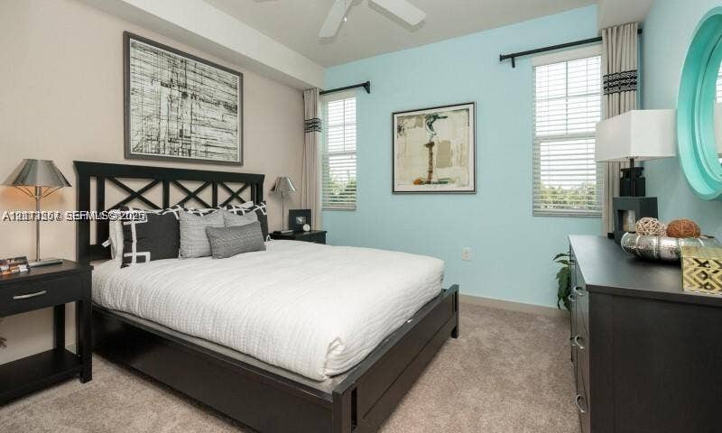 320 Franklin Club Drive, #Boca 1, Delray Beach, Delray Beach, FL 33483 Neutral-toned carpeting, two windows with horizontal blinds, and a ceiling fan