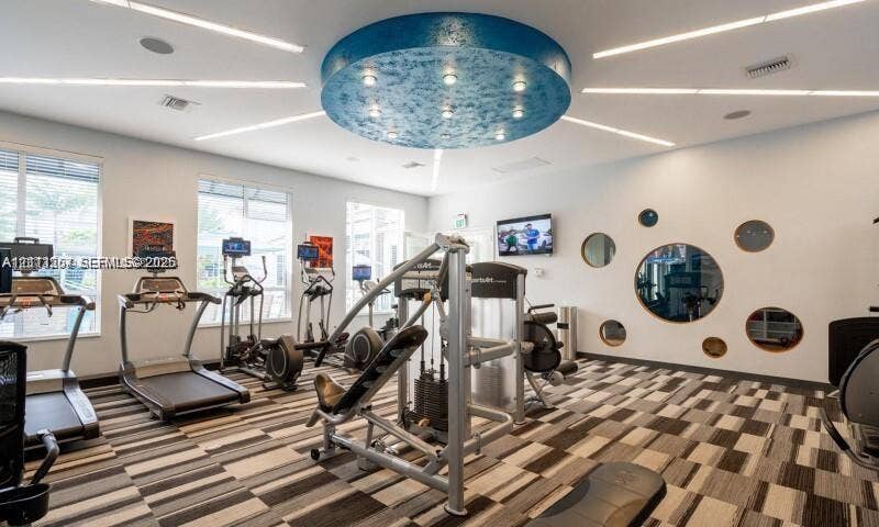 320 Franklin Club Drive, #Boca 1, Delray Beach, Delray Beach, FL 33483 Large-scale circular ceiling feature with recessed lighting, linear LED ceiling accents, multi-paneled windows, circular wall cutouts, and modular flooring tiles