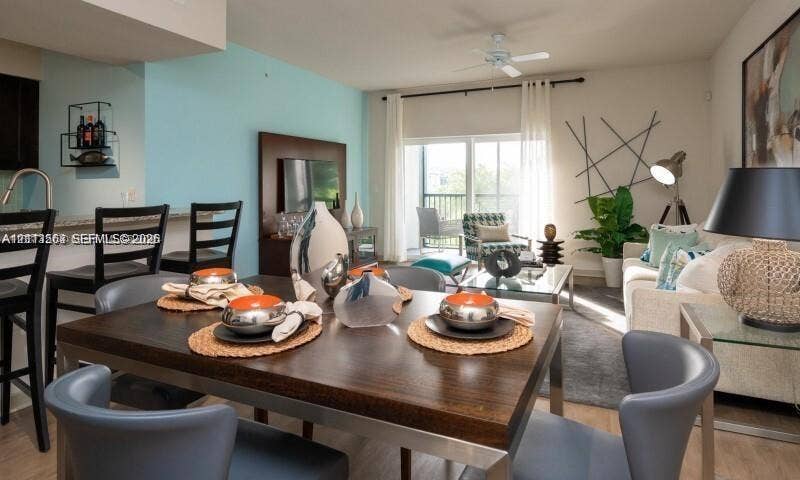 320 Franklin Club Drive, #Boynton, Delray Beach, Delray Beach, FL 33483 Open-concept living space featuring wood-finish flooring, recessed lighting, a ceiling fan, and sliding glass doors leading to a balcony