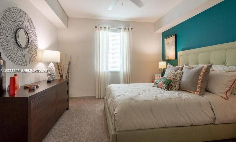 320 Franklin Club Drive, #Boynton, Delray Beach, Delray Beach, FL 33483 Bedroom featuring a teal accent wall, neutral carpeting, and a ceiling-mounted fan