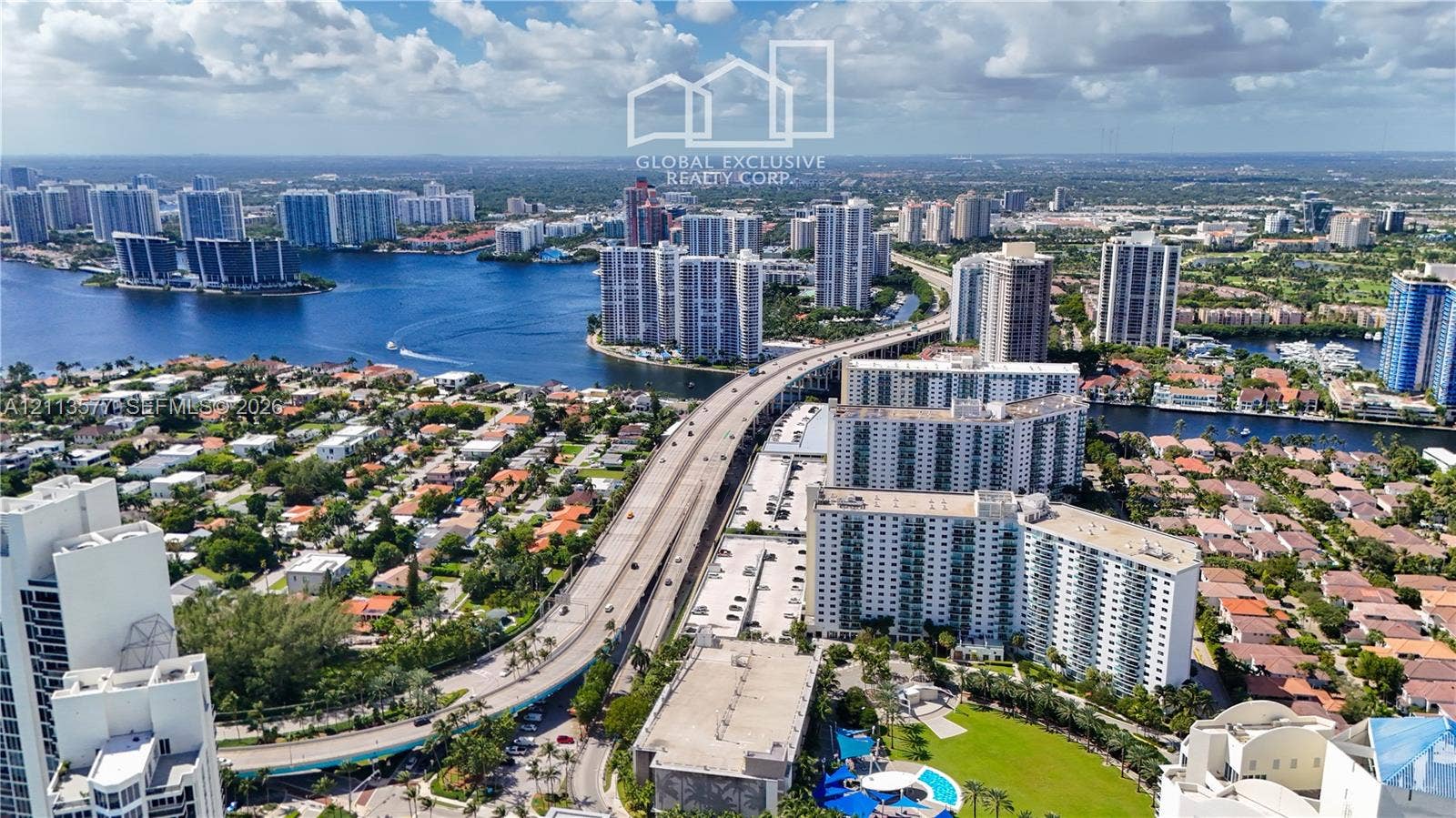 19370 Collins Avenue, #1622, Sunny Isles Beach, FL 33160 Aerial perspective showcasing waterfront access, proximity to major thoroughfares, and surrounding high-rise infrastructure