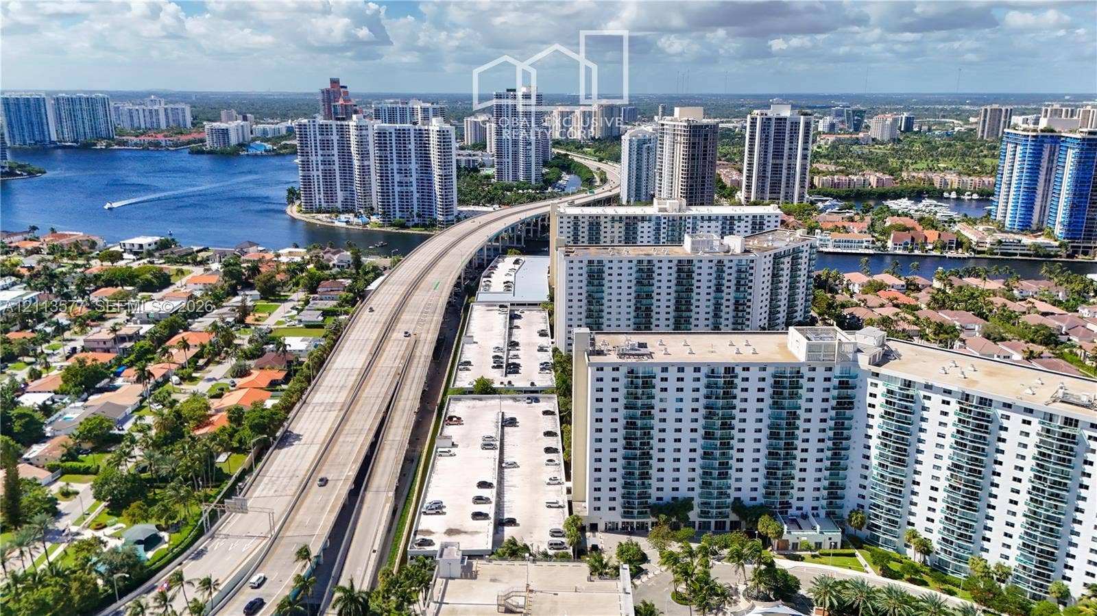 19370 Collins Avenue, #1622, Sunny Isles Beach, FL 33160 Aerial perspective featuring multi-story residential towers, coastal waterways, and proximity to infrastructure