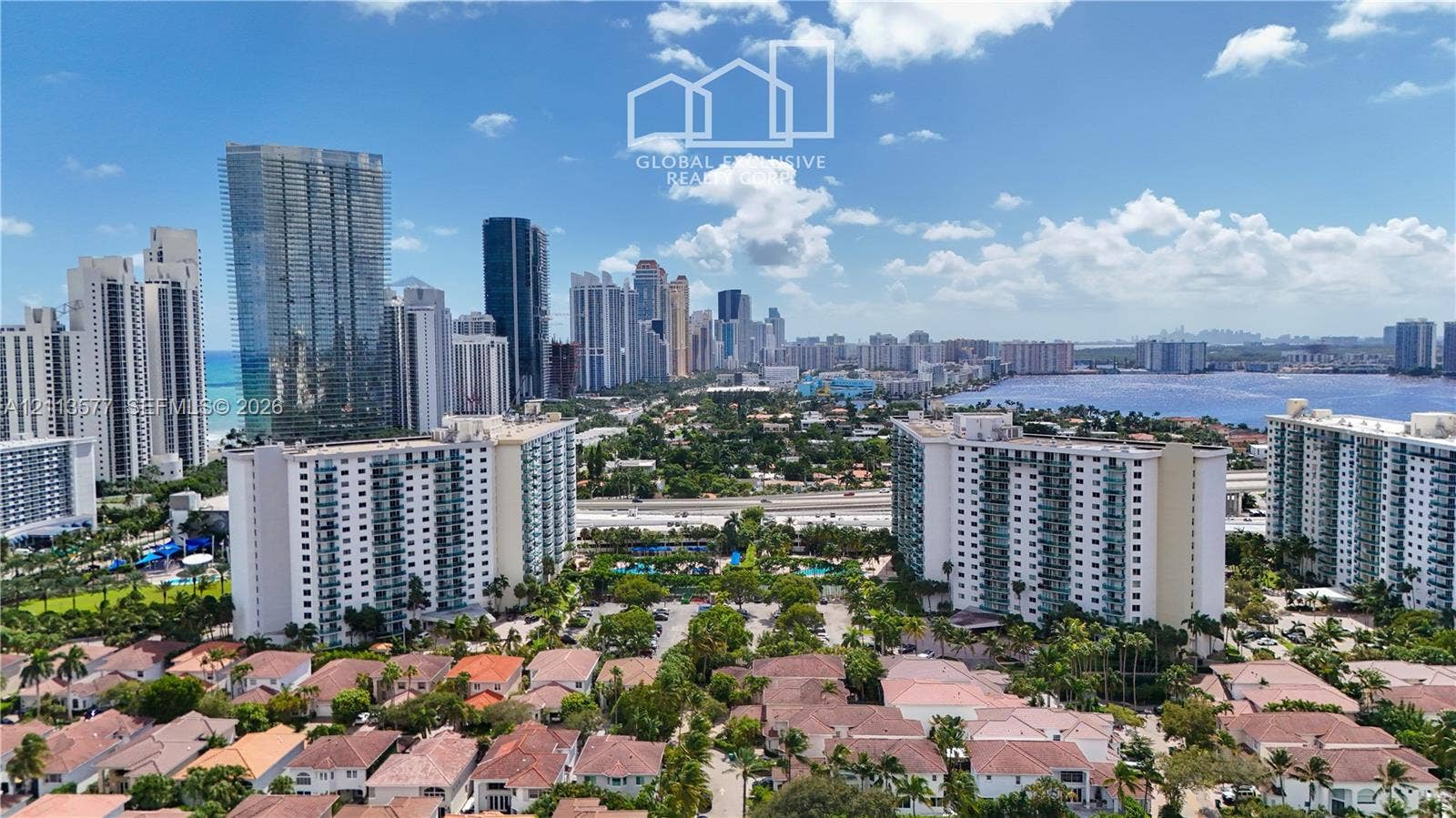 19370 Collins Avenue, #1622, Sunny Isles Beach, FL 33160 Aerial perspective of an urban skyline, high-rise buildings, coastal waterway, and residential properties