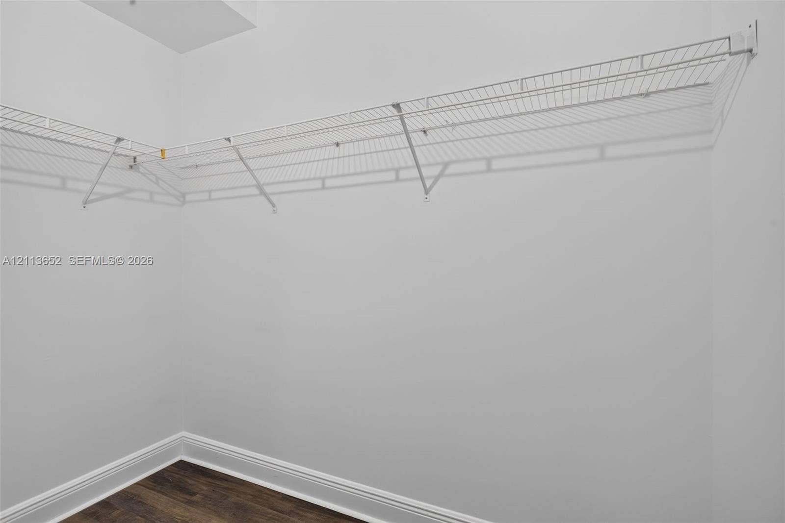 618 SW 1st Lane, Pompano Beach, FL 33060 L-shaped white wire shelving and wood-finish flooring