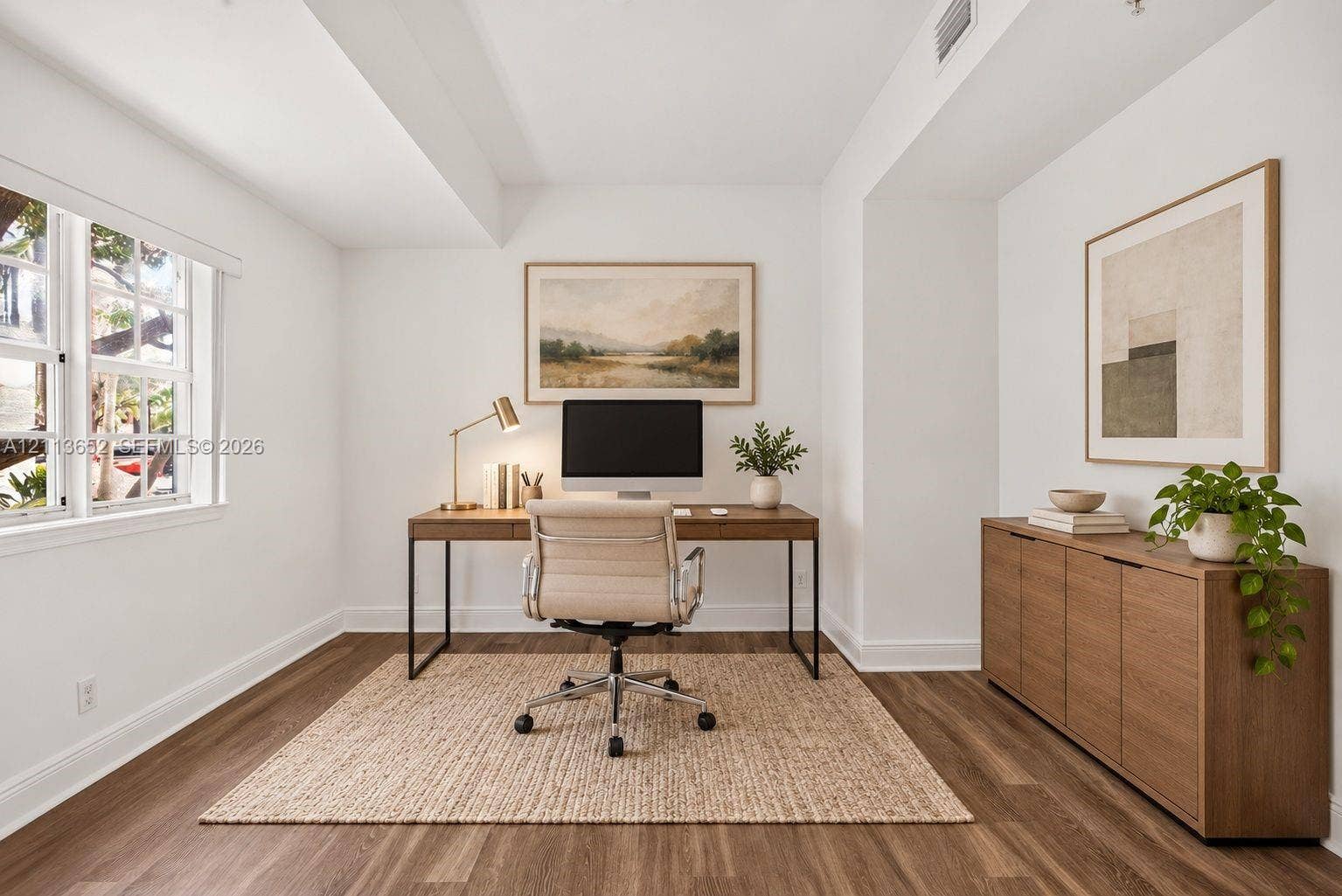 618 SW 1st Lane, Pompano Beach, FL 33060 Room featuring wood-finish flooring, multi-pane window, and neutral walls