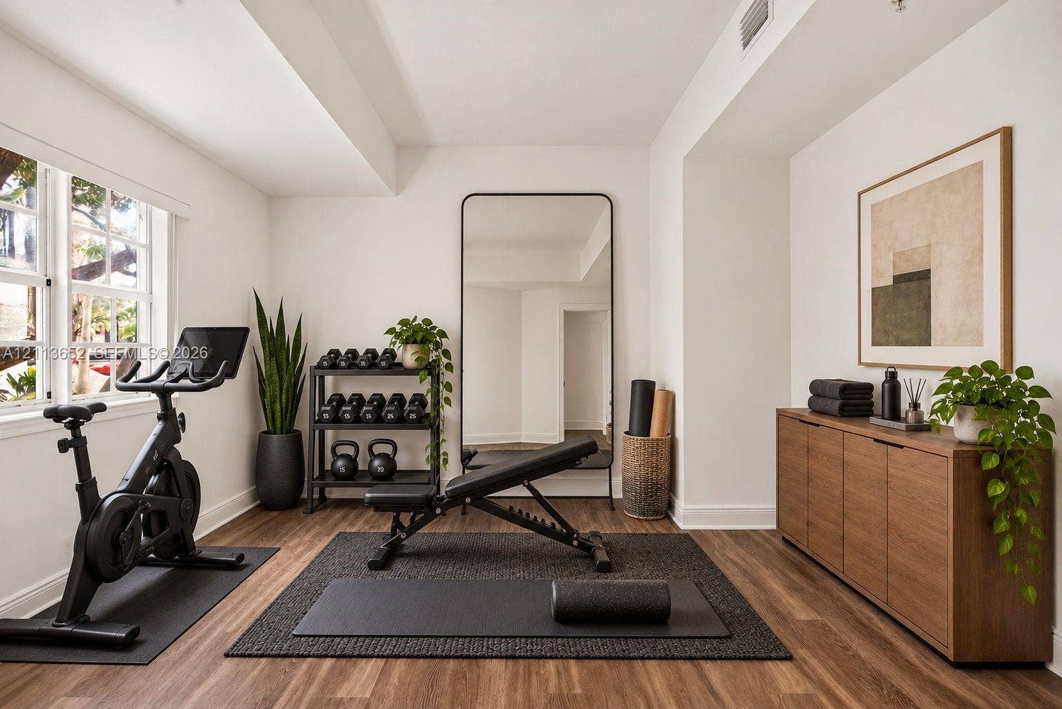 618 SW 1st Lane, Pompano Beach, FL 33060 Multipurpose room featuring wood-finish flooring, multi-pane windows, and a built-in recessed ceiling light fixture