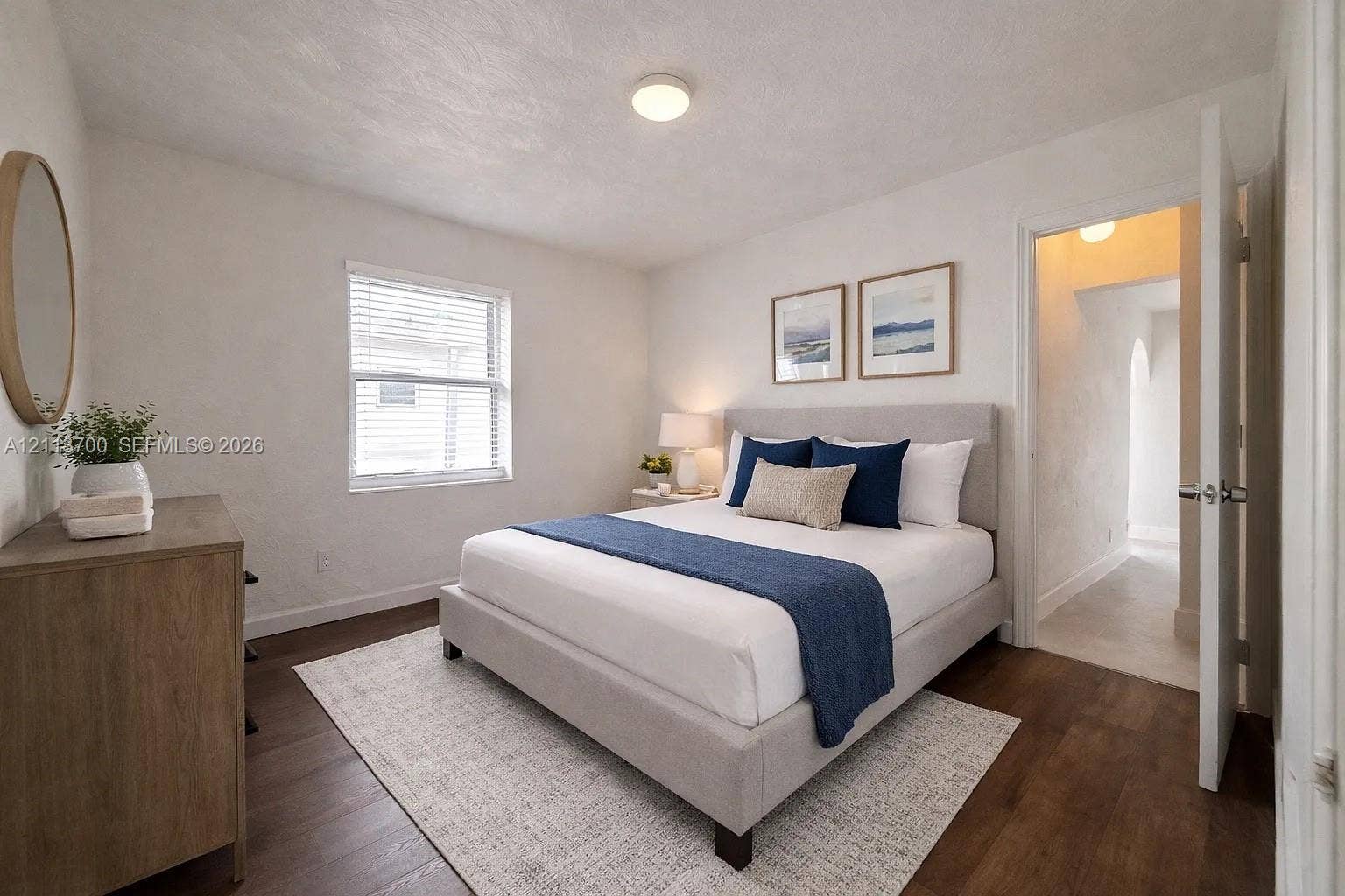 2707 Lincoln Street, #17-18, Hollywood, Hollywood, FL 33020 Wood-finish flooring, neutral wall tones, and single-pane window with horizontal blinds