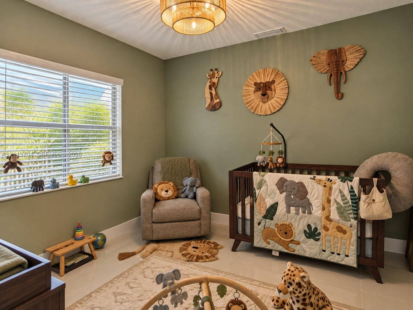 5254 SW 153rd Court, Miami, FL 33185 Neutral-toned room featuring a tiered drum-style ceiling light fixture, oversized window with horizontal blinds, and tile flooring