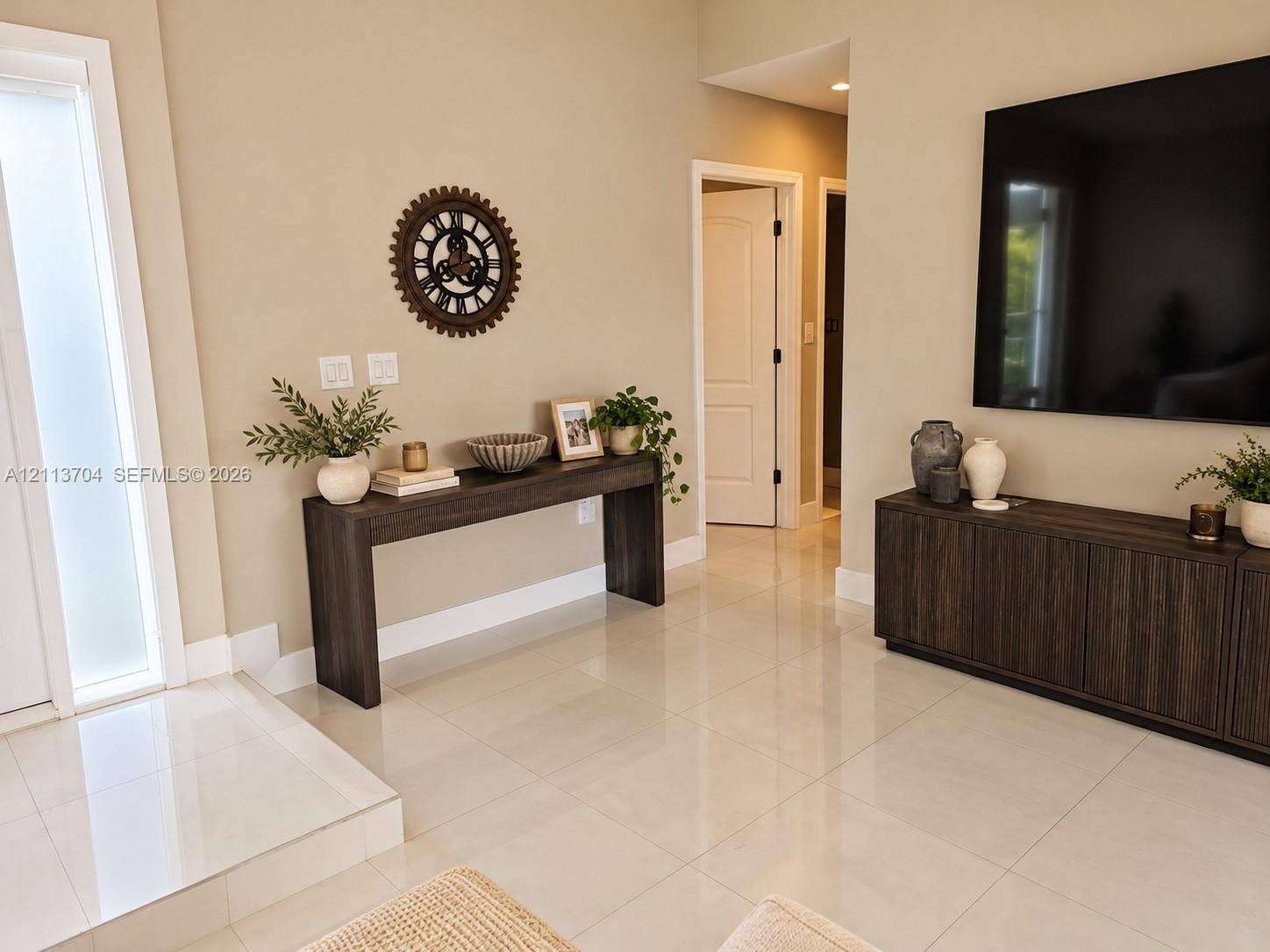 5254 SW 153rd Court, Miami, FL 33185 Polished light-toned tile flooring, door with frosted glass panel, and neutral wall color