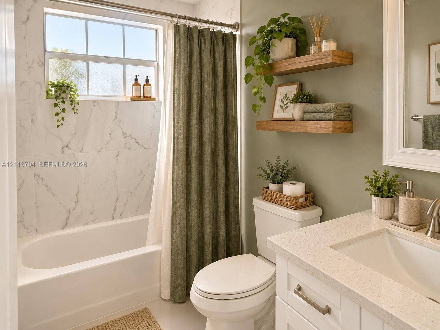 5254 SW 153rd Court, Miami, FL 33185 Full bathroom featuring a white porcelain tub with stone-finish surround, white vanity cabinet with a light-toned solid surface countertop, and dual mounted wood-finish floating shelves