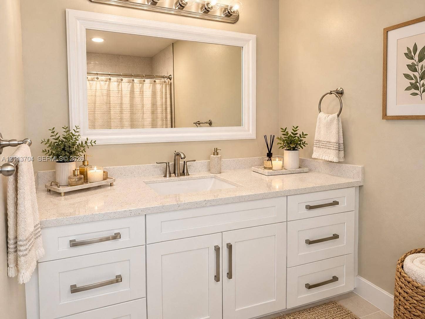 5254 SW 153rd Court, Miami, FL 33185 White shaker-style vanity featuring a speckled composite countertop, an undermount sink, brushed nickel hardware, and a large framed mirror