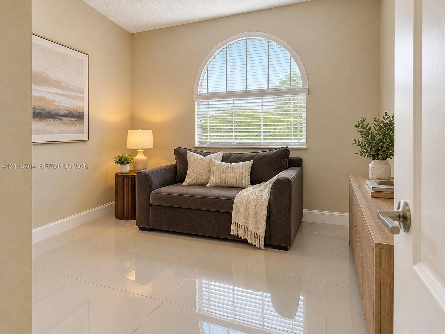 5254 SW 153rd Court, Miami, FL 33185 Polished tile flooring and arched window featuring horizontal blinds