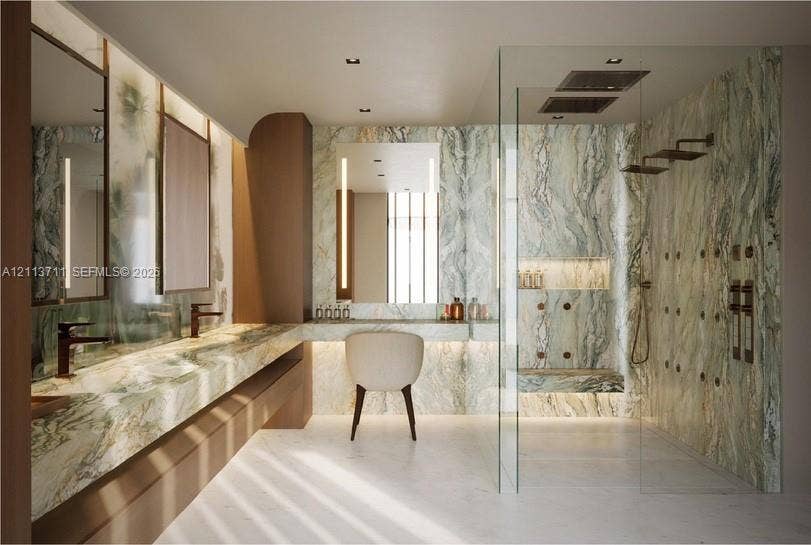 3322 NE 16th Court, Fort Lauderdale, FL 33305 Floating vanity with stone countertop, integrated lighting, wall-mounted faucets, and walk-in glass-enclosed shower with stone surround