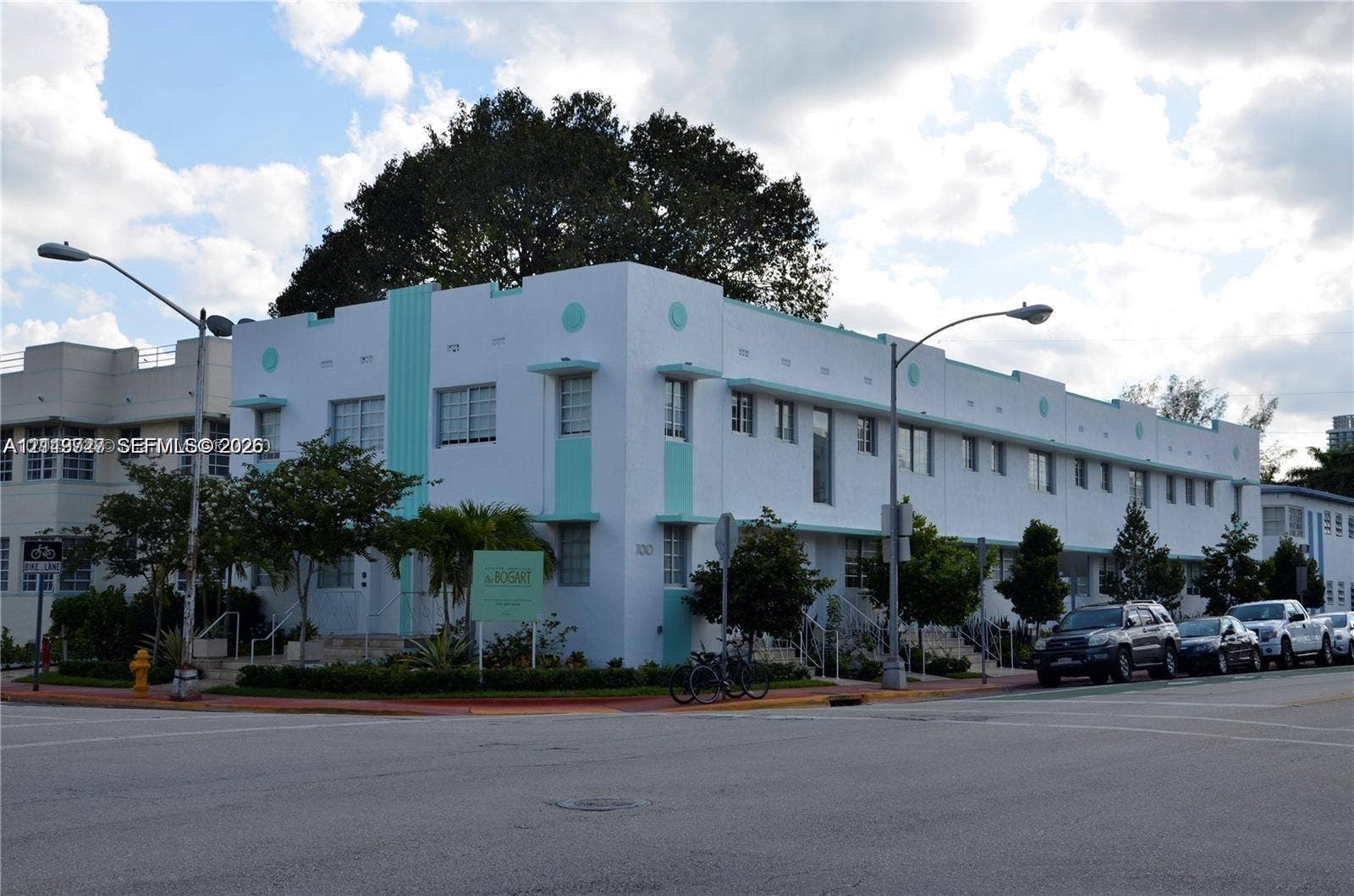 700 SE 16th Street, #201, Miami Beach, Miami Beach, FL 33139 Art Deco building exterior featuring a geometric stucco facade, decorative horizontal bands, cantilevered window awnings, and multi-pane casement windows