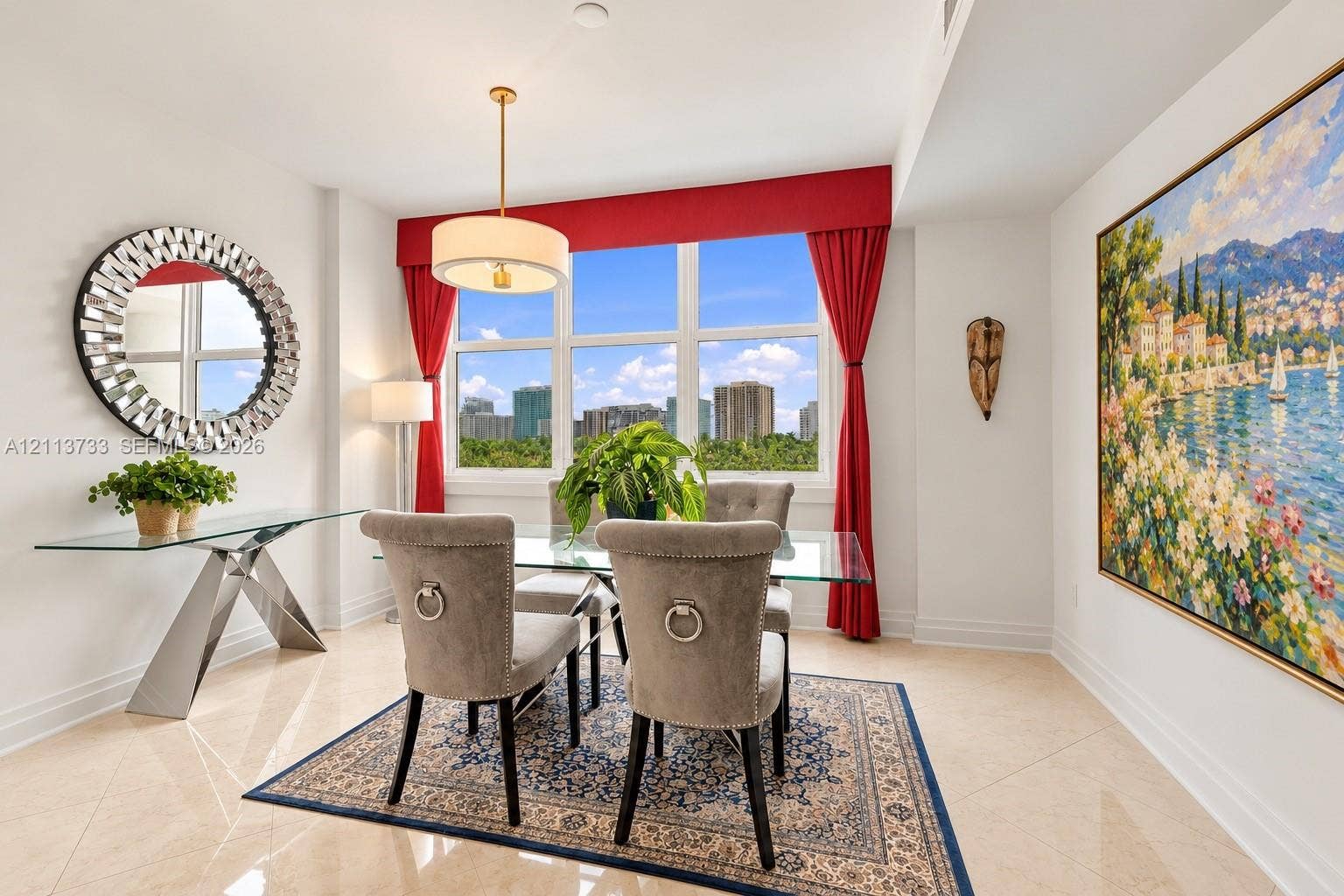 9751 E Bay Harbor Drive, #6A, Bay Harbor Islands, FL 33154 Large, multi-pane window featuring custom fabric valance and treatments, suspended drum-style pendant light, and polished neutral-tone tile flooring