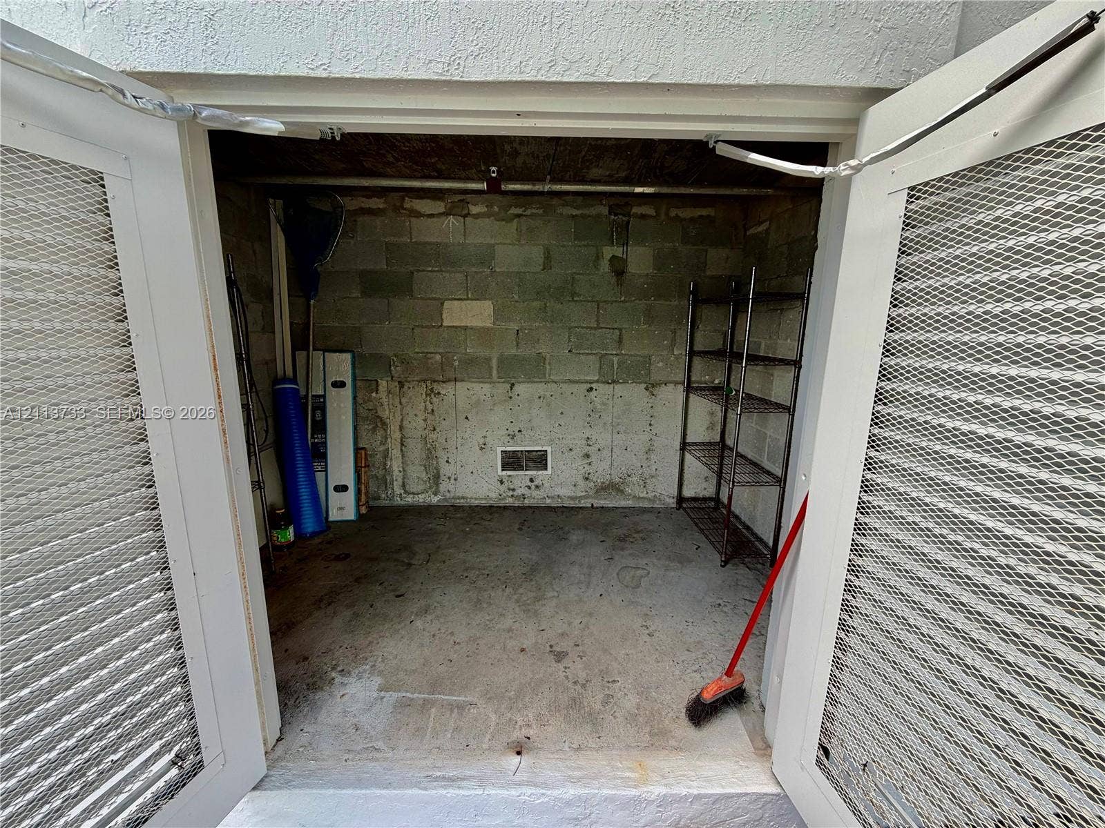 9751 E Bay Harbor Drive, #6A, Bay Harbor Islands, FL 33154 Electric hooks ups in your Private boat cabana Storage area with dual white louvered doors, concrete flooring, and masonry wall construction.