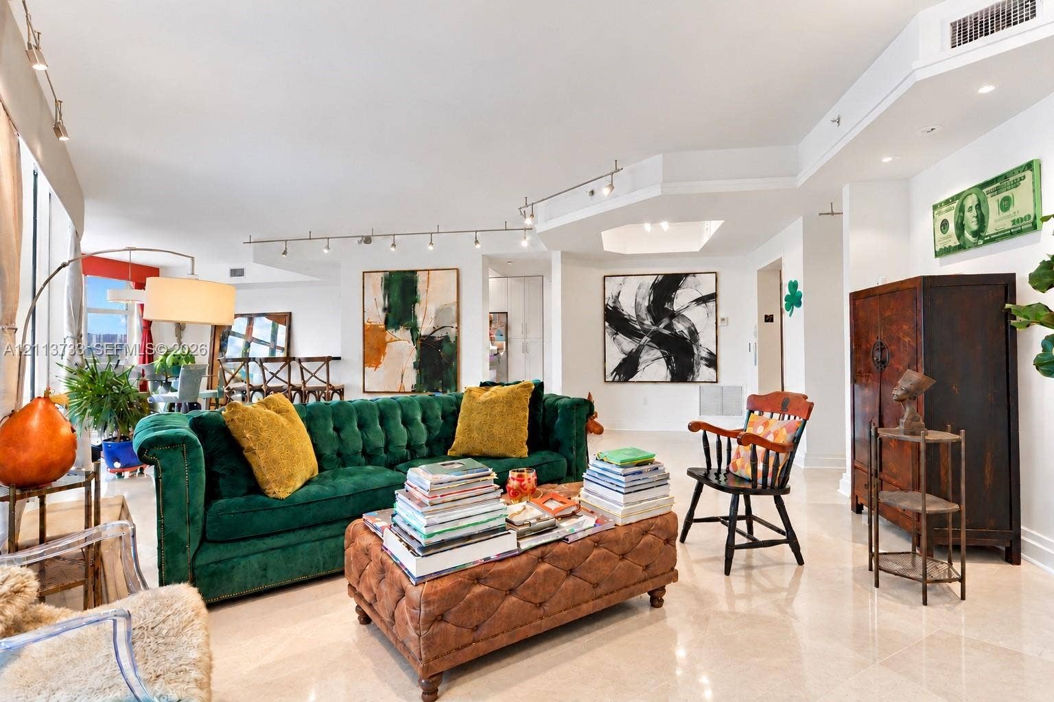 9751 E Bay Harbor Drive, #6A, Bay Harbor Islands, FL 33154 Open-concept interior featuring large-format polished stone flooring, adjustable track lighting, and a multi-tiered recessed ceiling