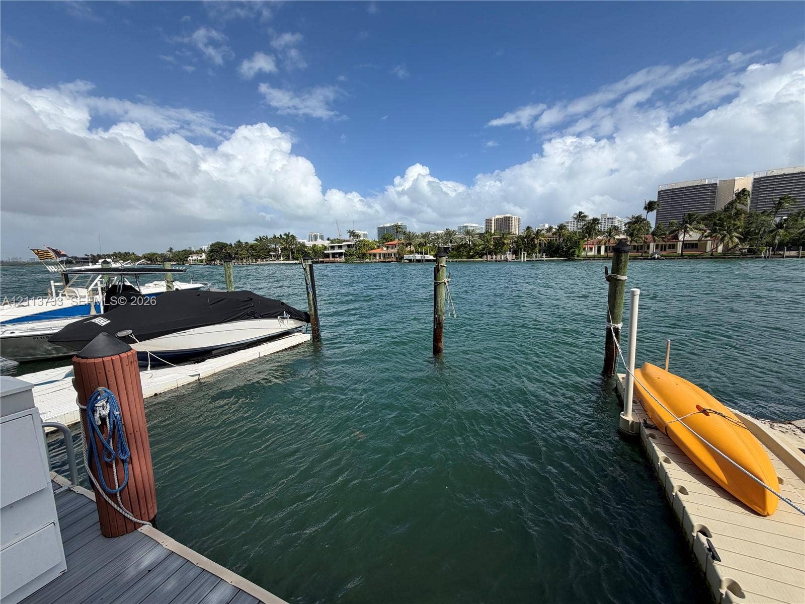 9751 E Bay Harbor Drive, #6A, Bay Harbor Islands, FL 33154 Waterfront property featuring a private floating dock system, multiple deep-water pilings, and direct bulkhead access