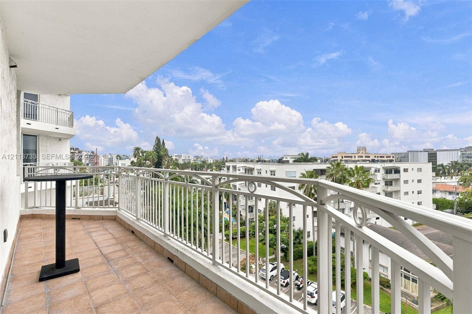 9751 E Bay Harbor Drive, #6A, Bay Harbor Islands, FL 33154 Private balcony featuring ceramic tile flooring and a decorative metal railing