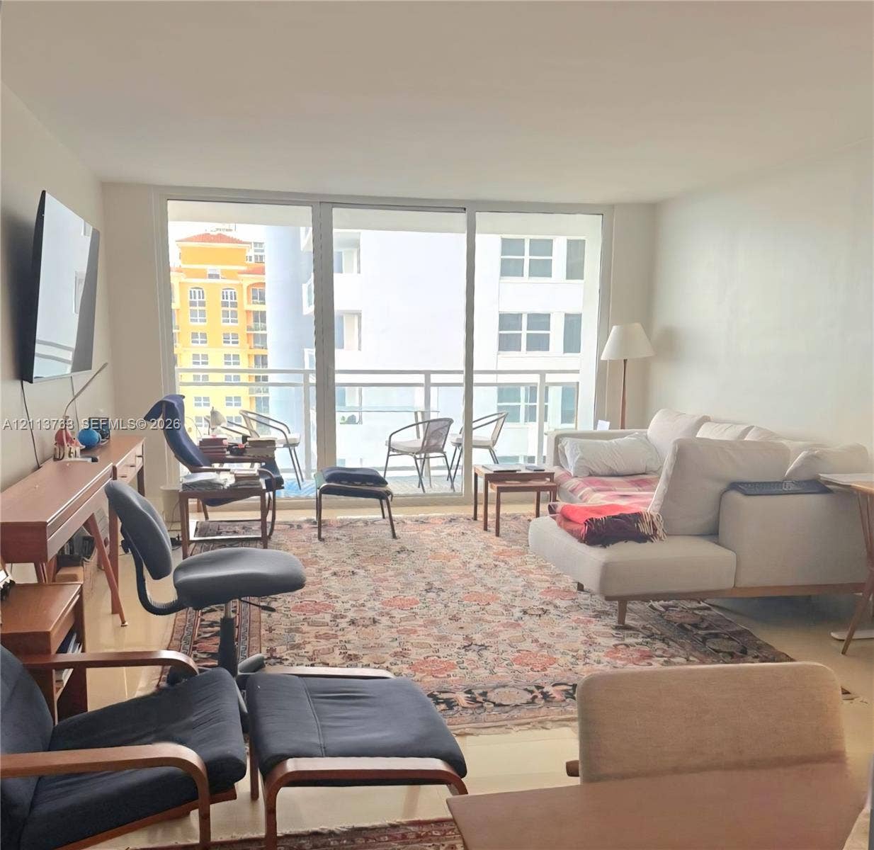 2030 S Ocean Drive, #1719, Hallandale Beach, FL 33009 Floor-to-ceiling glass panel windows, neutral ceramic tile flooring, and a private balcony with metal railing