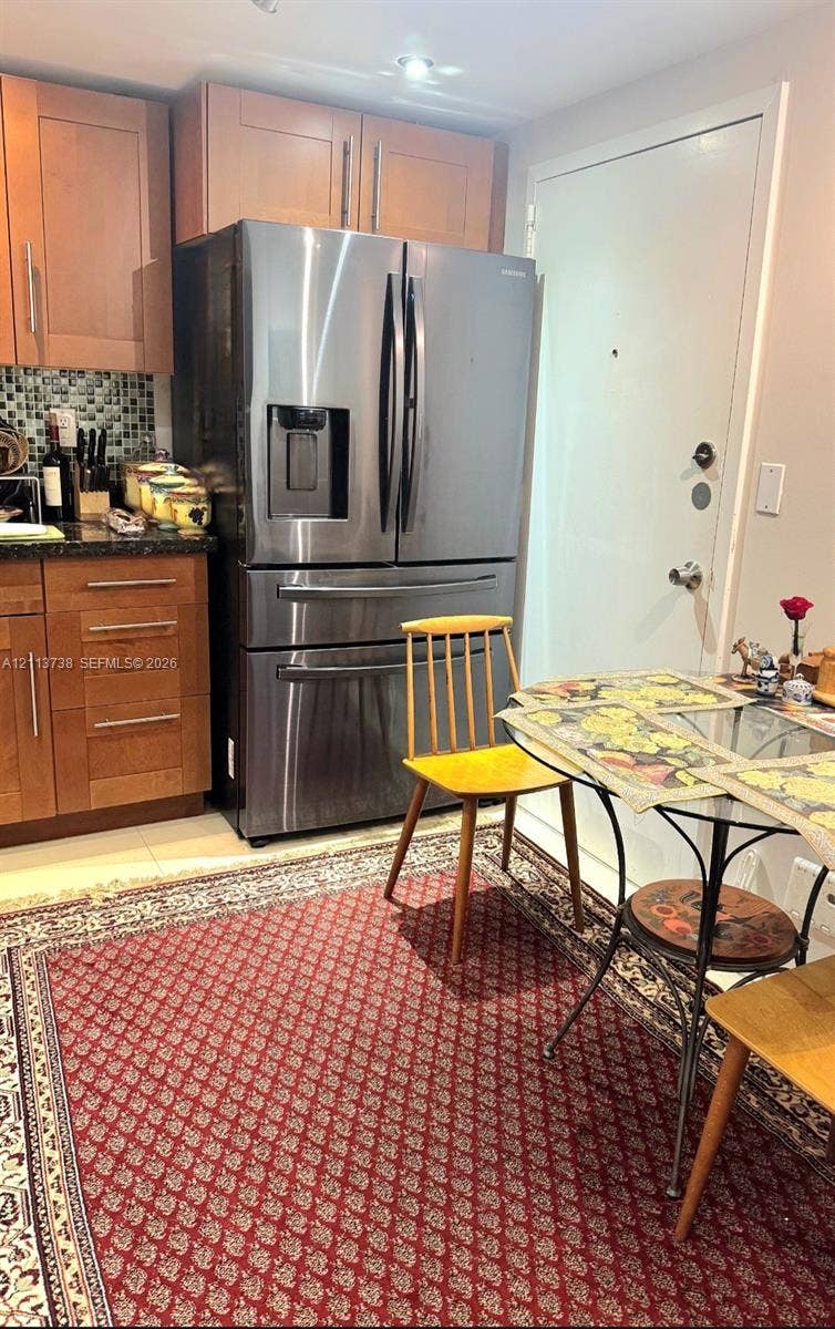 2030 S Ocean Drive, #1719, Hallandale Beach, FL 33009 Kitchen featuring flat-panel wood cabinetry, dark stone countertops, mosaic tile backsplash, stainless steel French-door refrigerator, and recessed lighting