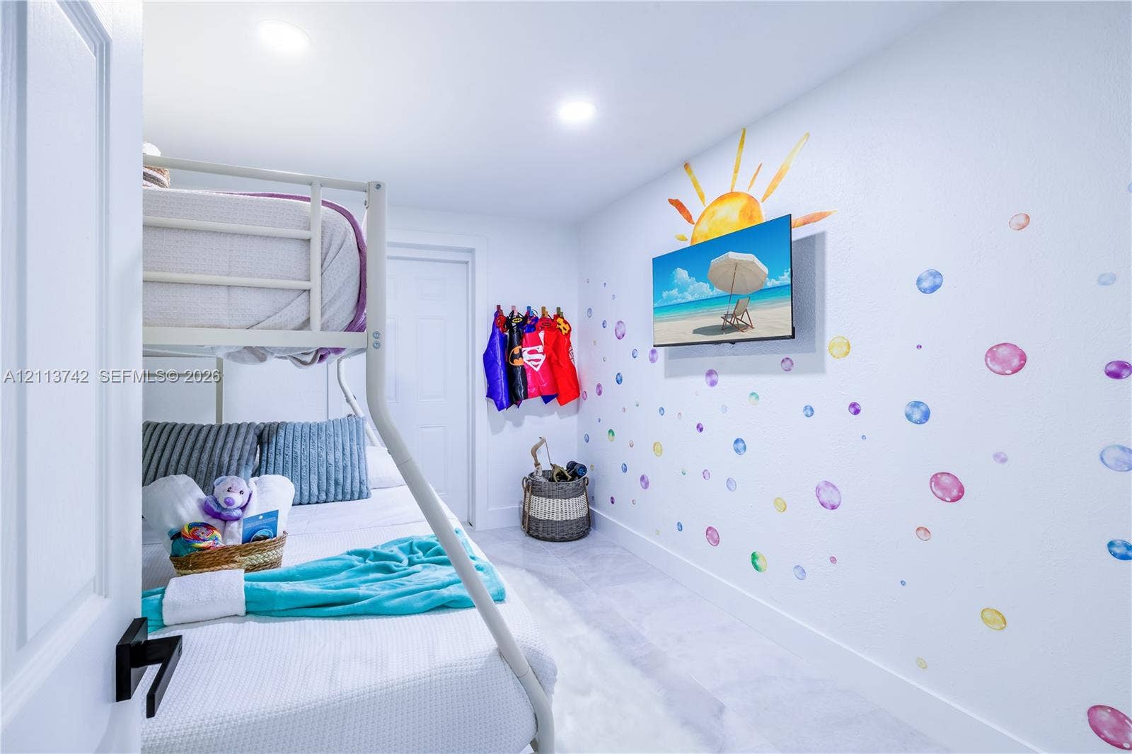 1930 NW 163rd St Road, Miami Gardens, FL 33054 Interior room featuring tile flooring, recessed ceiling lighting, and a wall-mounted flat-screen television