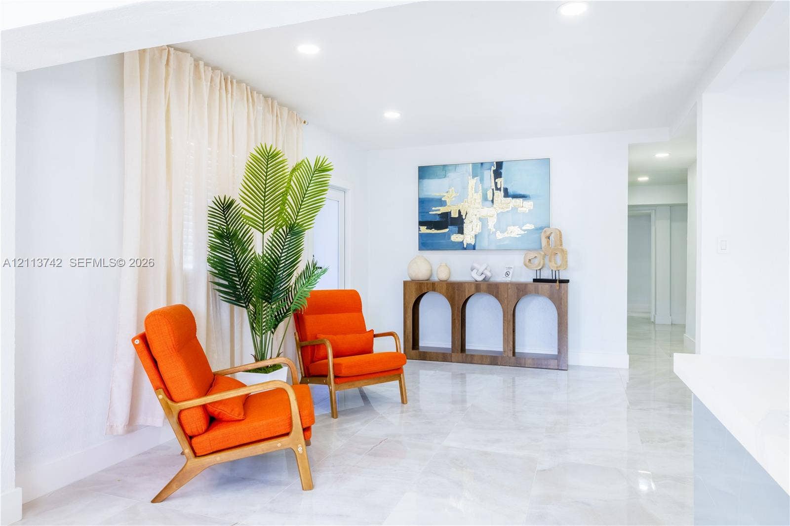 1930 NW 163rd St Road, Miami Gardens, FL 33054 Neutral-toned stone-finish flooring and recessed ceiling lighting