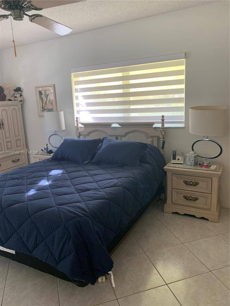 1501 Arthur Street, #1, Hollywood, FL 33020 Ceramic tile flooring, horizontal dual-layer shade, and ceiling fan with integrated light fixture