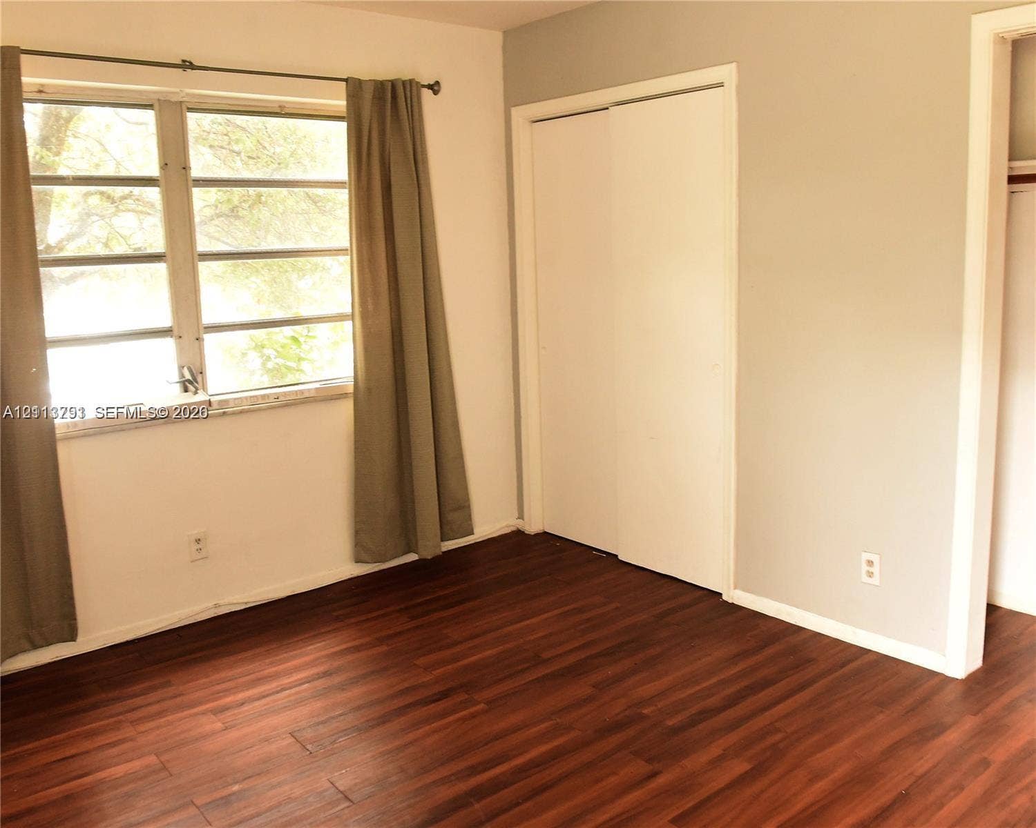716 SE 18th Street, #1, Fort Lauderdale, Fort Lauderdale, FL 33316 Wood-finish flooring, multi-pane windows, and a sliding closet door