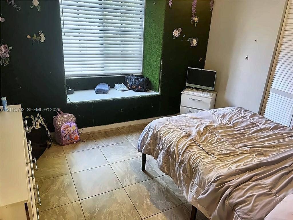 11530 NW 43rd, #1, Coral Springs, Coral Springs, FL 33065 Large-format tile flooring, recessed window seat, and built-in closet with louvred doors