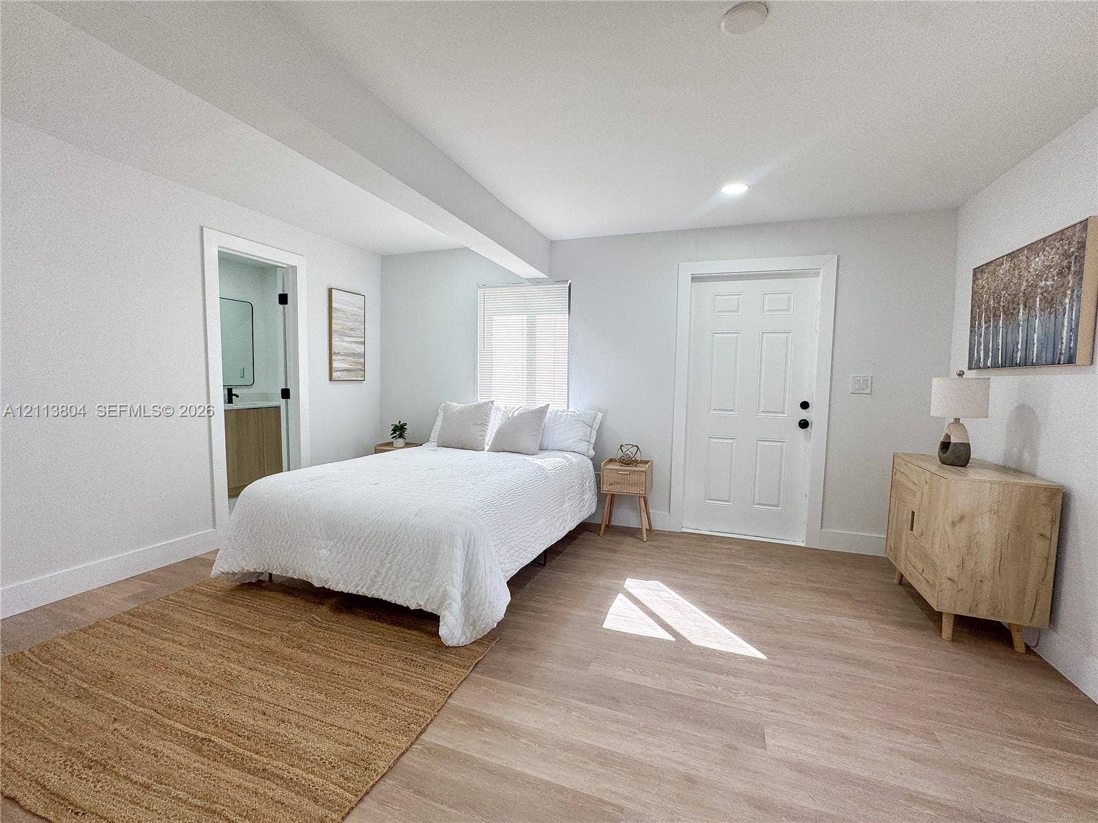 2300 NW 31st Avenue, Fort Lauderdale, FL 33311 Room featuring wood-finish flooring, a six-panel door, and recessed lighting