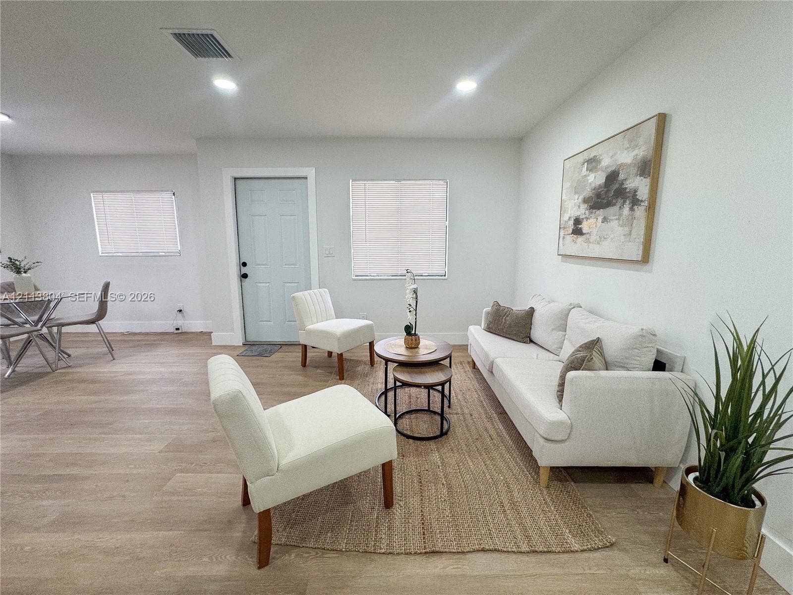2300 NW 31st Avenue, Fort Lauderdale, FL 33311 Open-concept interior featuring light-toned wood-finish flooring, recessed lighting, and crisp neutral wall color