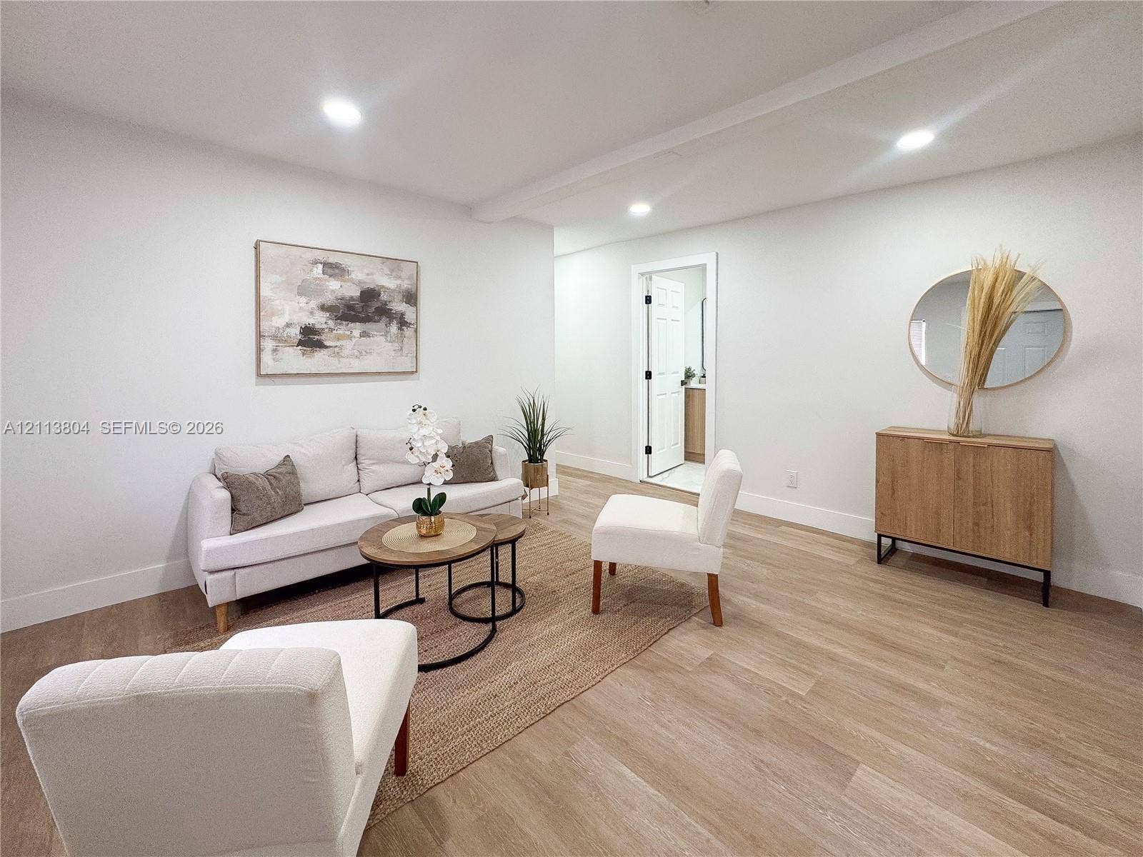 2300 NW 31st Avenue, Fort Lauderdale, FL 33311 Open-concept space featuring recessed ceiling lighting, neutral walls, and wood-finish flooring