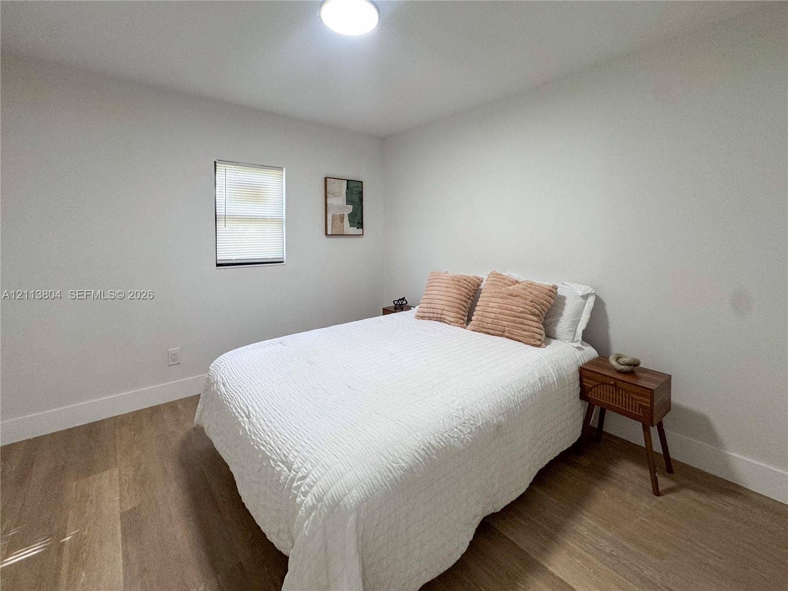 2300 NW 31st Avenue, Fort Lauderdale, FL 33311 Neutral-toned interior featuring wood-finish flooring, crisp white walls, and a recessed ceiling light