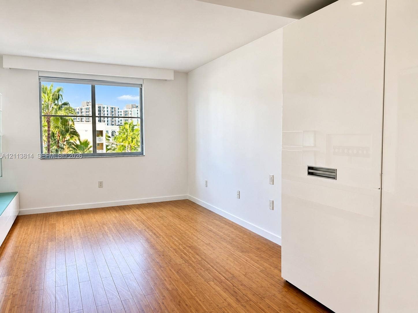 110 Washington Avenue, #1517, Miami Beach, Miami Beach, FL 33139 Wood-finish flooring, high-gloss white built-in cabinetry, and large-format windows