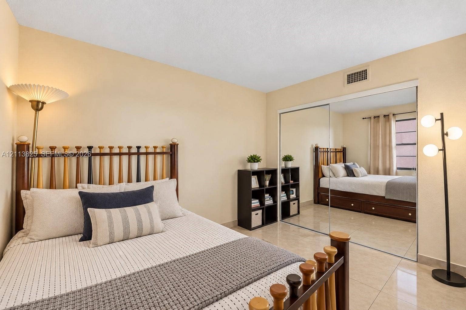 1200 NW 80th Avenue, #405A, Margate, FL 33063 Neutral-toned interior space featuring polished tile flooring and a wall-length sliding mirror closet