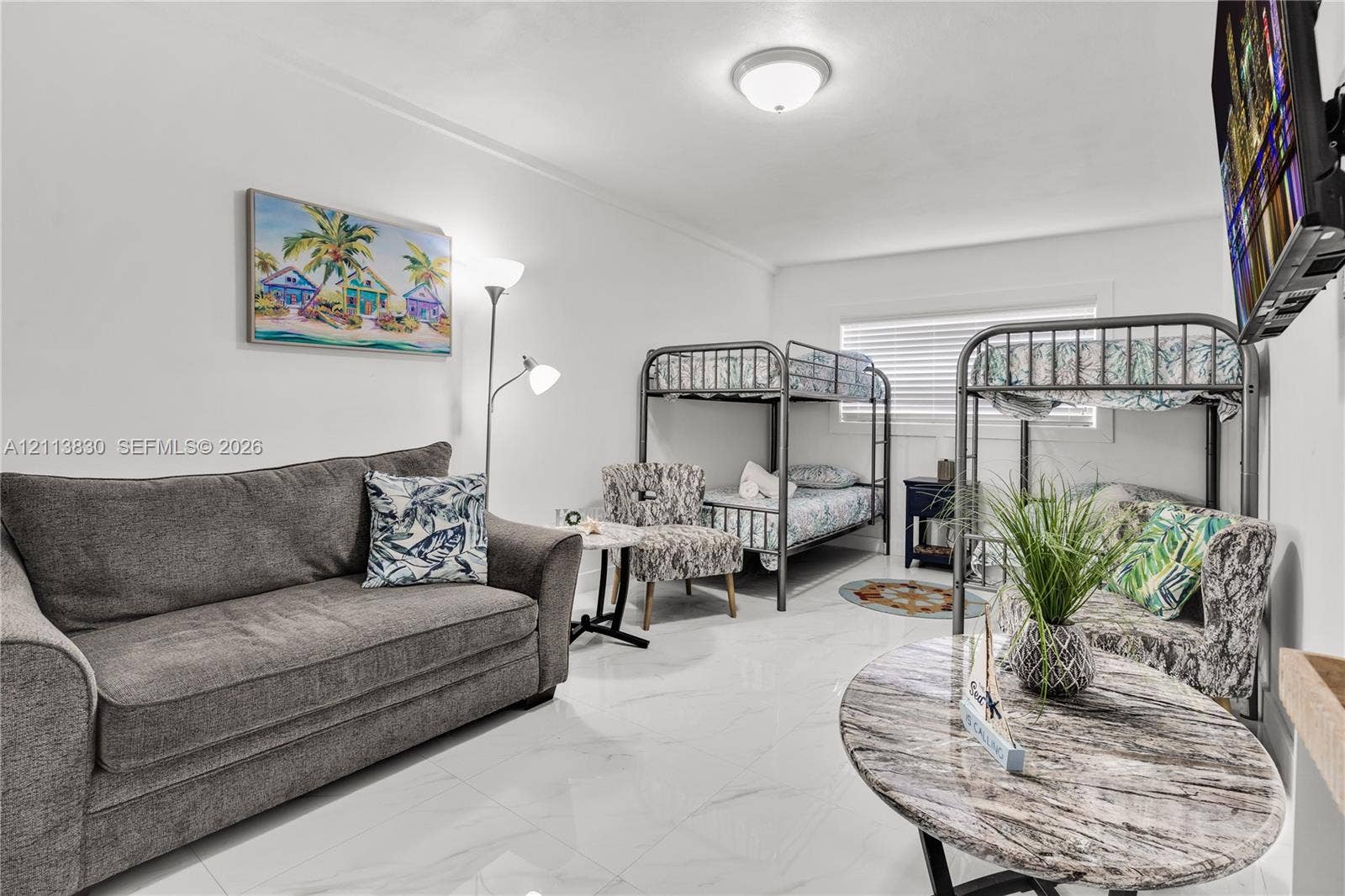 3545 SW 104th Court, Miami, FL 33165 Large-format polished tile flooring, neutral wall tones, and recessed ceiling lighting with horizontal blinds