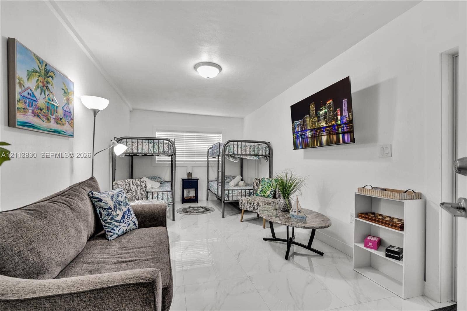 3545 SW 104th Court, Miami, FL 33165 Spacious room featuring polished stone-finish tile flooring, clean white walls, and a recessed ceiling light fixture