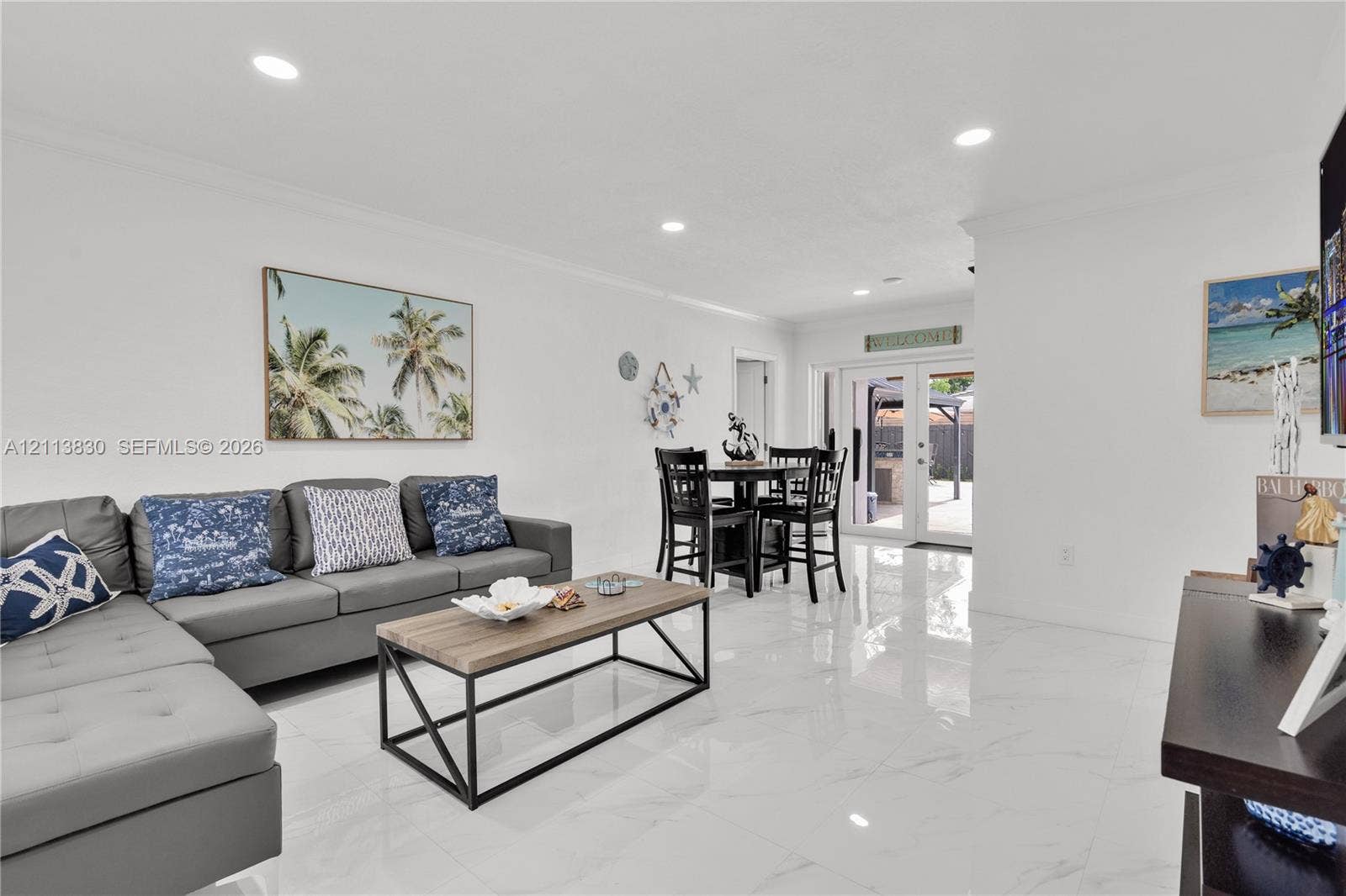 3545 SW 104th Court, Miami, FL 33165 Large-format tile flooring, recessed ceiling lighting, and double glass doors