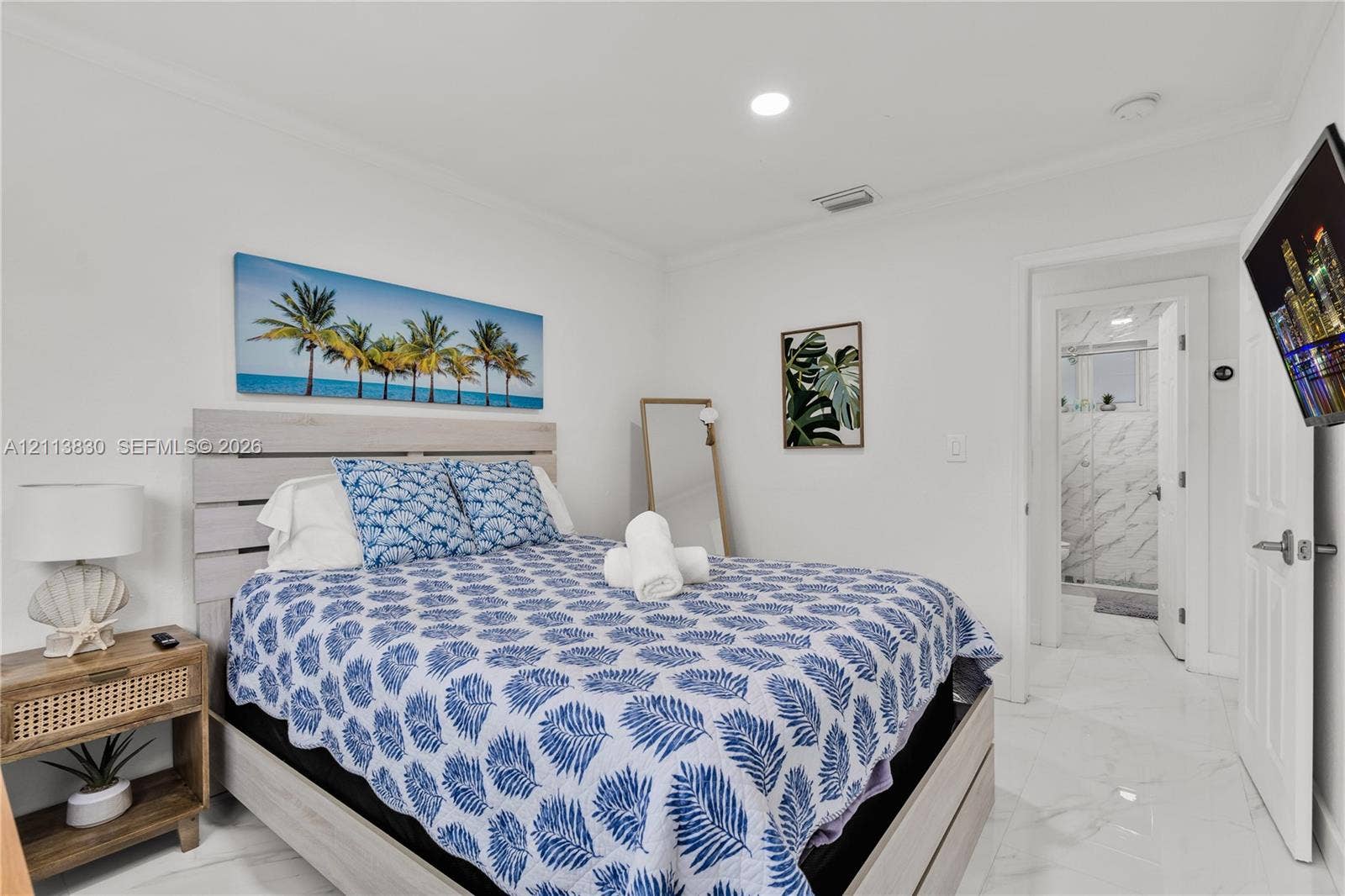 3545 SW 104th Court, Miami, FL 33165 Neutral-toned walls paired with large-format light-colored tile flooring, featuring recessed ceiling lighting and a multi-panel door