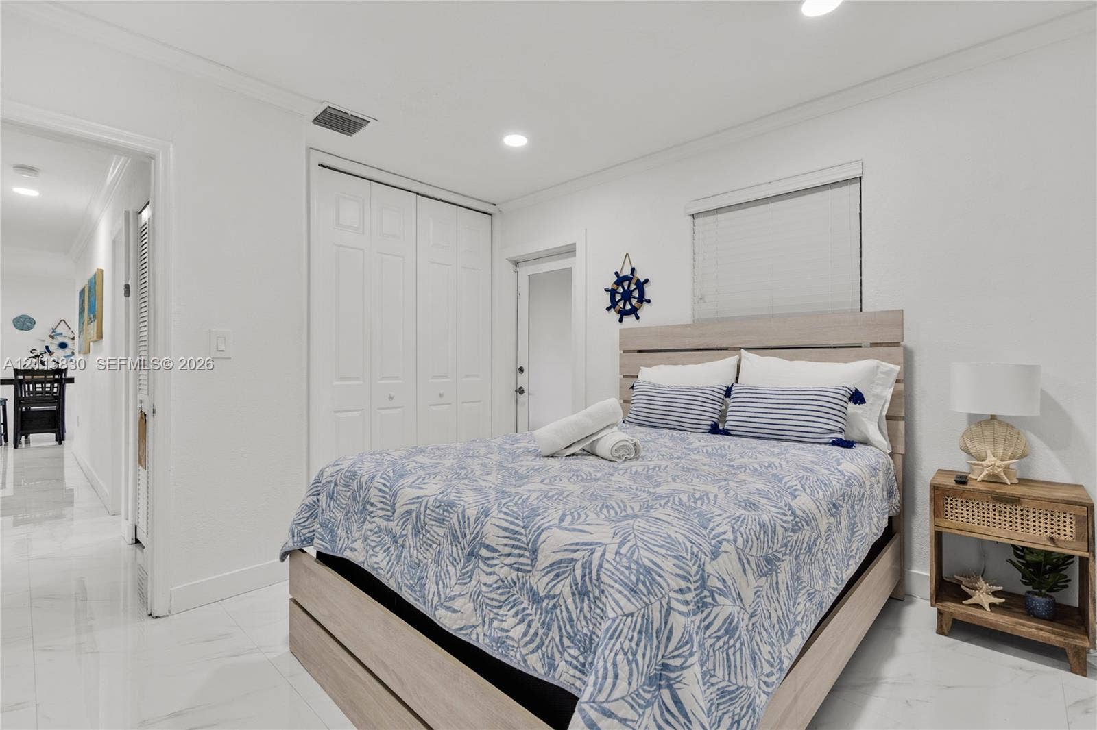 3545 SW 104th Court, Miami, FL 33165 Neutral-toned interior featuring gloss-finish tile flooring, recessed ceiling lighting, and built-in closet storage with double-panel doors