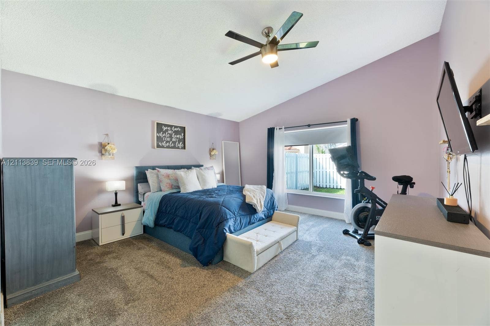 1015 NW 124th Terrace, Sunrise, FL 33323 Vaulted ceiling with integrated multi-blade ceiling fan and wall-to-wall carpeting