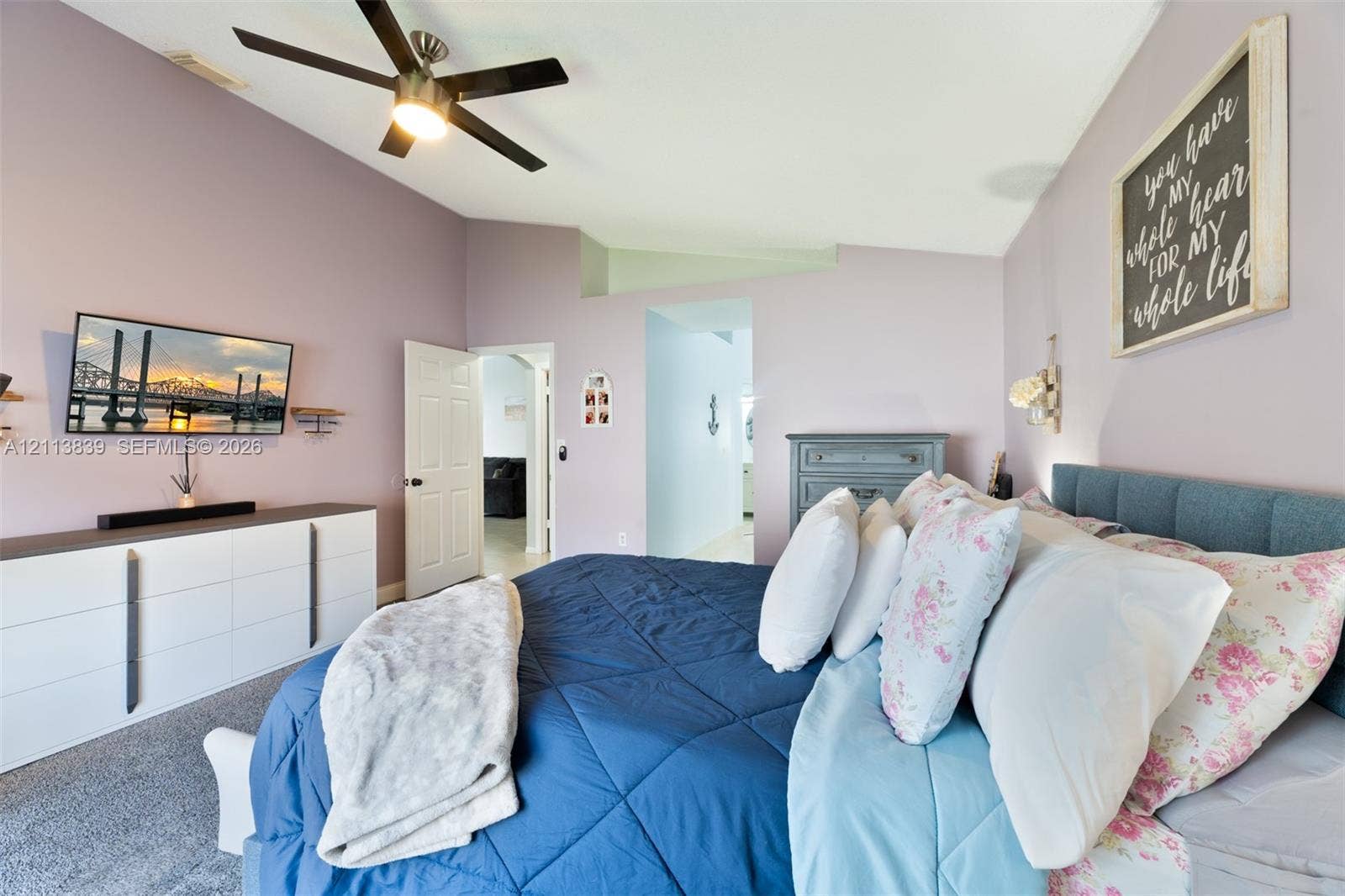 1015 NW 124th Terrace, Sunrise, FL 33323 Vaulted ceiling with an integrated multi-blade ceiling fan and wall-to-wall carpeting