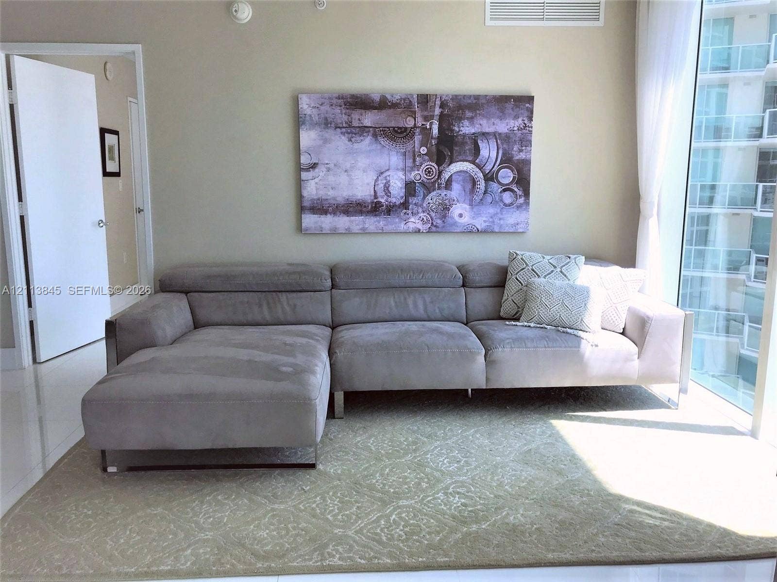 250 Sunny Isles Boulevard, #3-1506, Sunny Isles Beach, Sunny Isles Beach, FL 33160 Floor-to-ceiling glass wall, white tile flooring, and neutral wall tones