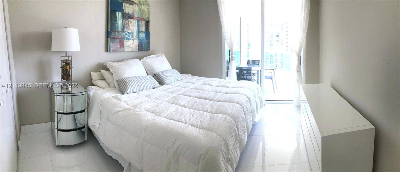 250 Sunny Isles Boulevard, #3-1506, Sunny Isles Beach, Sunny Isles Beach, FL 33160 Spacious interior featuring white tile flooring, neutral wall tones, and glass sliding doors providing external access