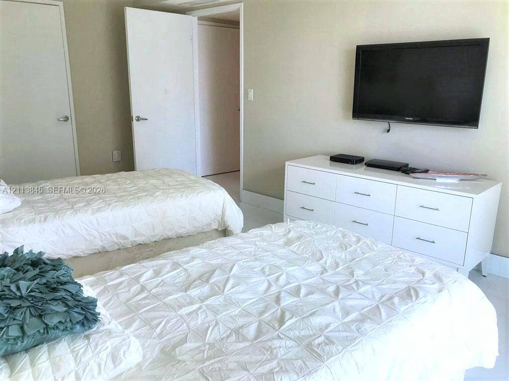 250 Sunny Isles Boulevard, #3-1506, Sunny Isles Beach, Sunny Isles Beach, FL 33160 Neutral-toned wall finish featuring two interior doors and hard-surface flooring