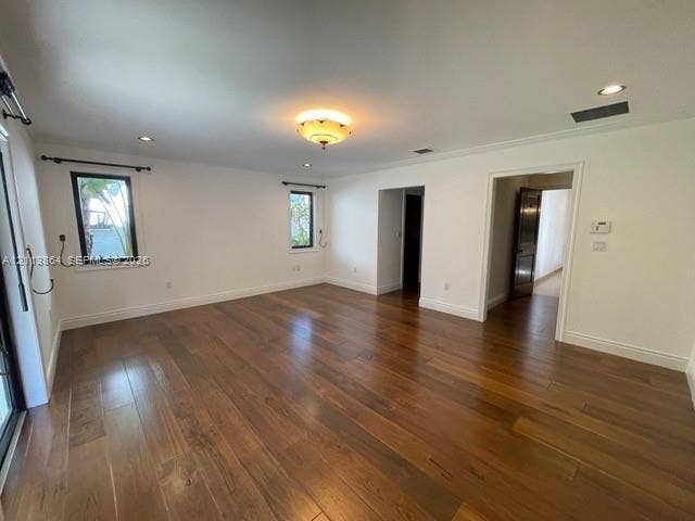 721 Tibidabo Avenue, #0, Coral Gables, Coral Gables, FL 33143 Open-concept living space featuring wood-finish flooring, recessed lighting, crown molding, and large windows with dark hardware