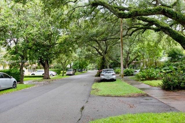 721 Tibidabo Avenue, #0, Coral Gables, Coral Gables, FL 33143 Asphalt street lined with mature canopy trees and manicured grass borders