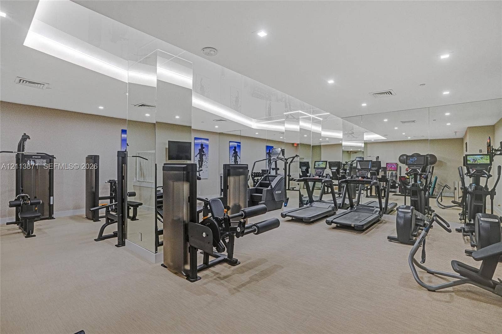 3640 Yacht Club Drive, #1208, Aventura, FL 33180 Fitness center featuring mirrored walls, recessed ceiling lighting, and neutral wall-to-wall carpeting